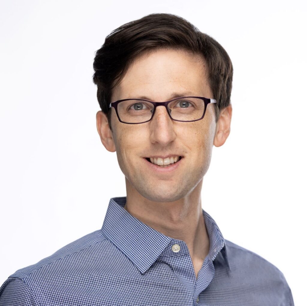 Headshot of Neil Gormley with a white background.